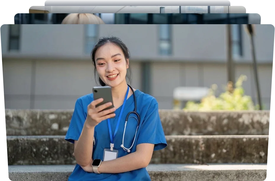 happy female nurse reading his smartphone device