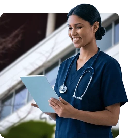 happy female nurse using her tablet device